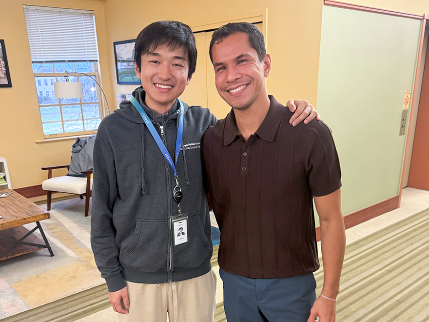 student and professor pose for photo