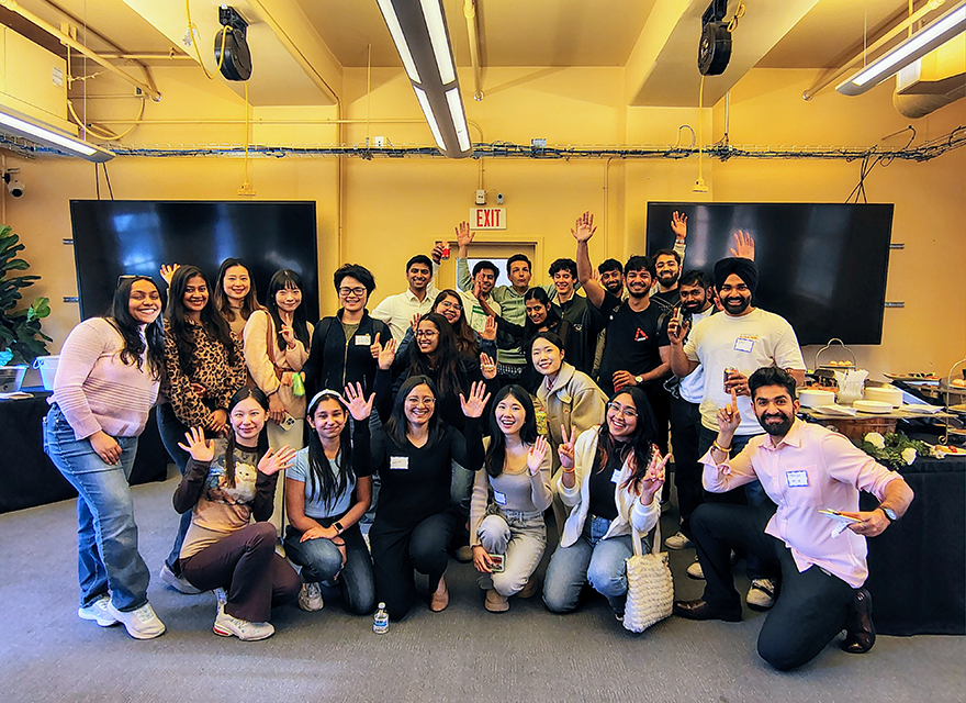 students pose for photo at hiring event